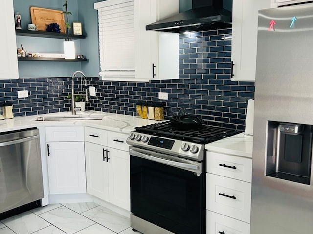 kitchen with tasteful backsplash, sink, wall chimney exhaust hood, and appliances with stainless steel finishes