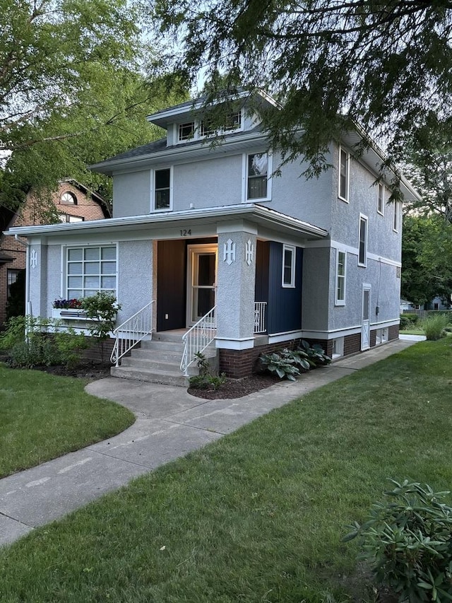 front facade featuring a front lawn