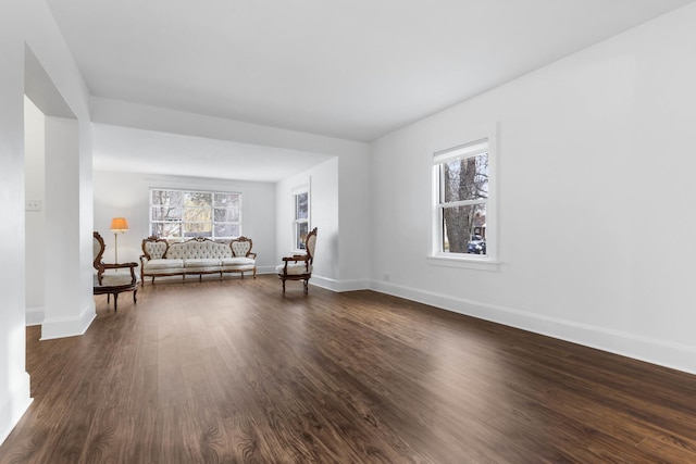 unfurnished room featuring dark wood-type flooring