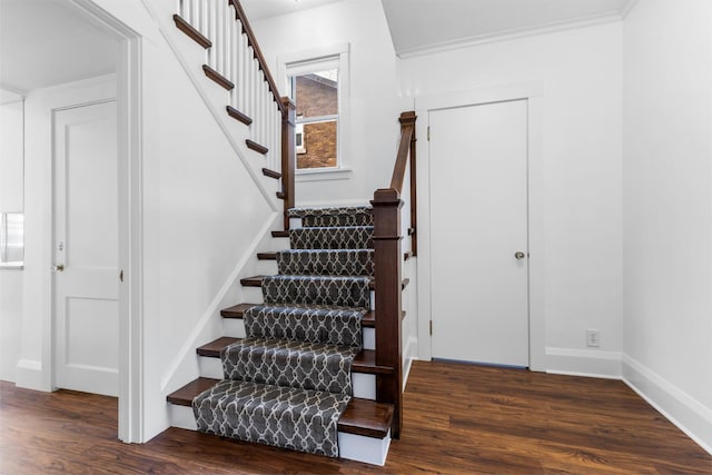 stairway featuring hardwood / wood-style flooring and ornamental molding