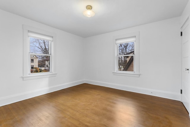 spare room with wood-type flooring