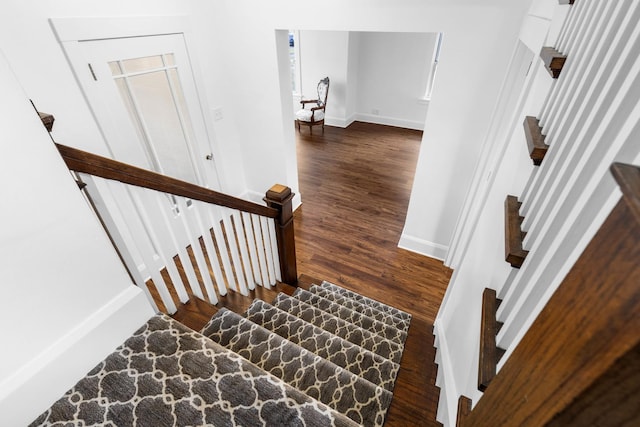 staircase featuring hardwood / wood-style floors