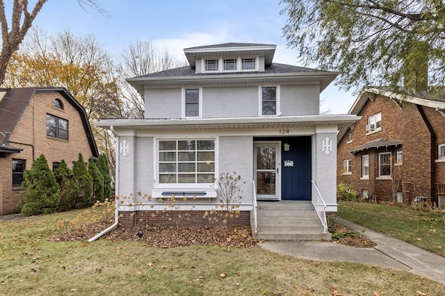 view of front of property with a front lawn