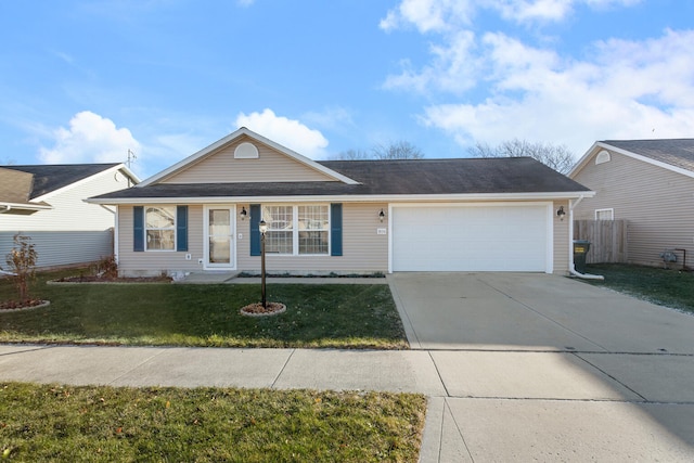 ranch-style house featuring a front yard and a garage