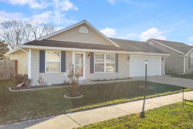 ranch-style home with a front lawn and a garage