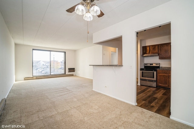 living room with a textured ceiling, baseboard heating, dark carpet, and ceiling fan