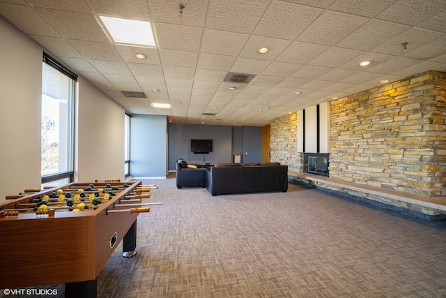 game room with a drop ceiling and carpet floors