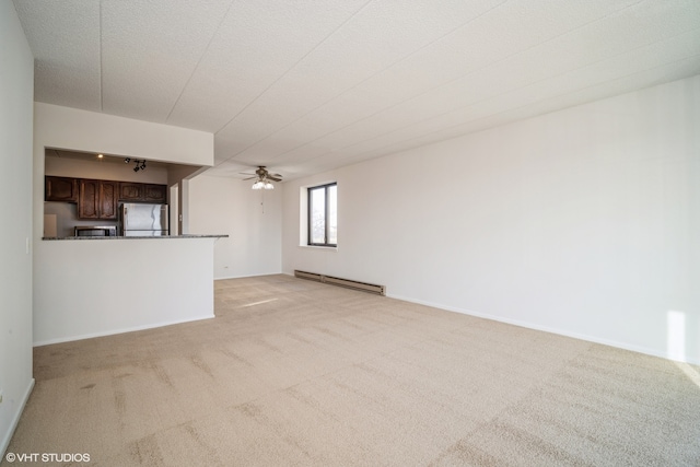 unfurnished living room featuring ceiling fan, light colored carpet, and a baseboard radiator