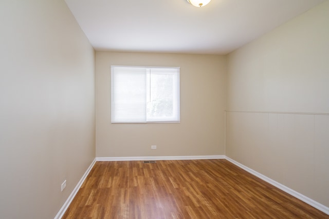 empty room featuring hardwood / wood-style floors