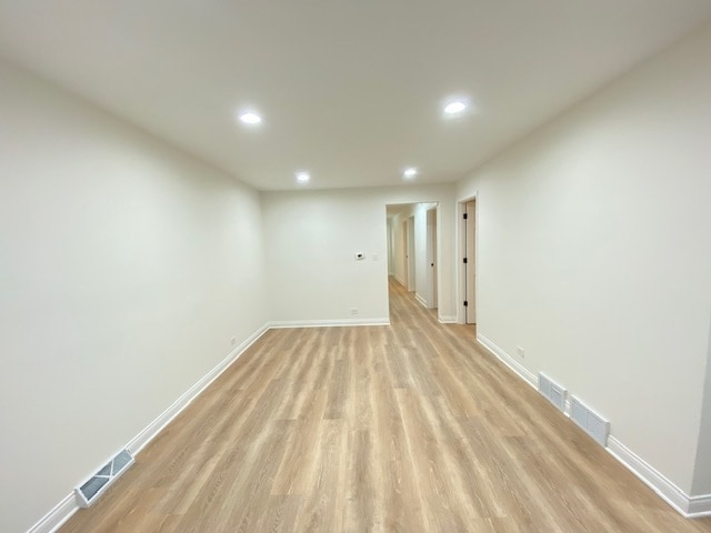 unfurnished room with light hardwood / wood-style floors