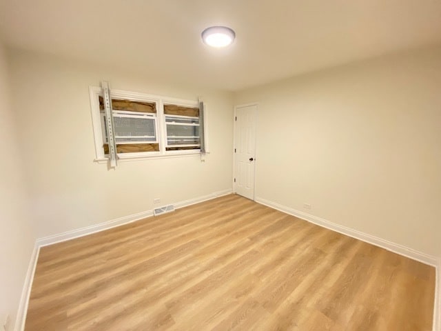 spare room featuring hardwood / wood-style floors