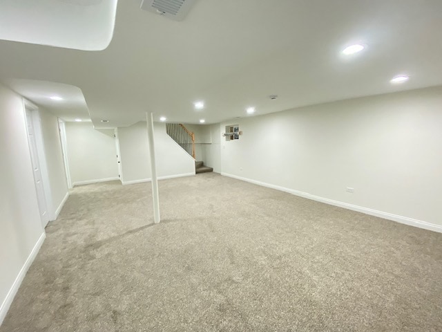 basement with light colored carpet