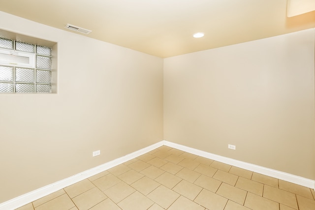 spare room with light tile patterned floors