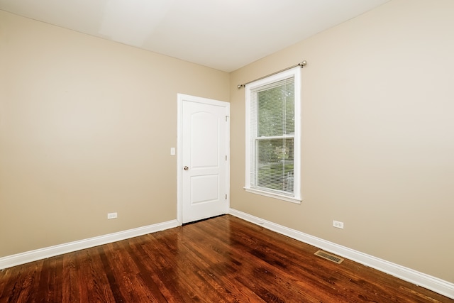 empty room featuring hardwood / wood-style flooring