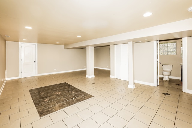 basement with light tile patterned flooring