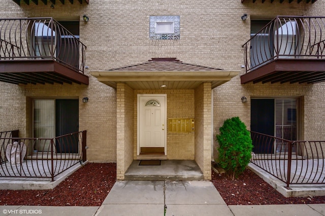 property entrance with a balcony