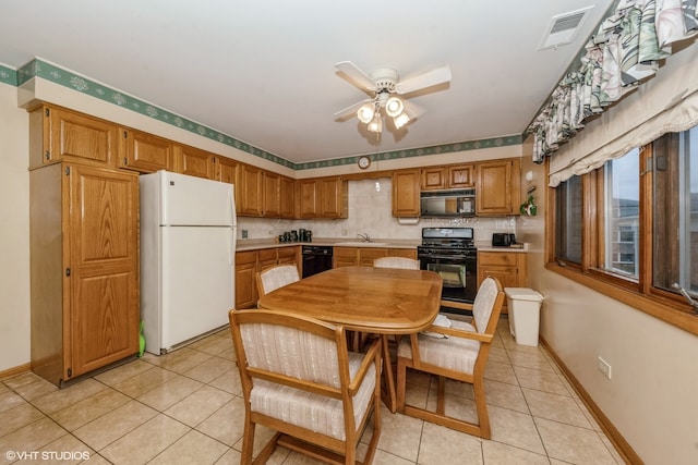 kitchen featuring black appliances, sink, ceiling fan, decorative backsplash, and light tile patterned floors