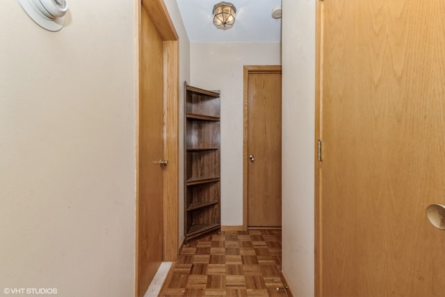 hall featuring dark parquet flooring