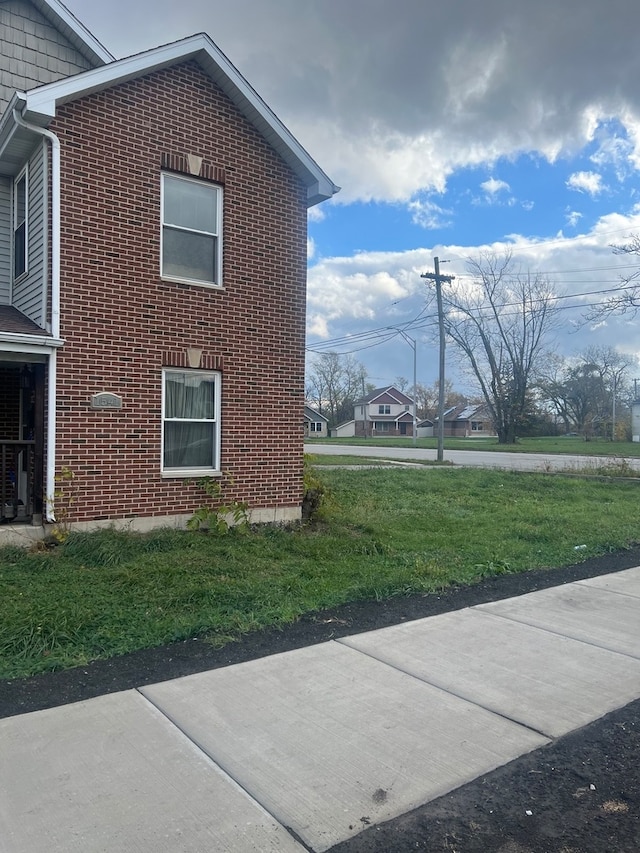 view of property exterior featuring a yard