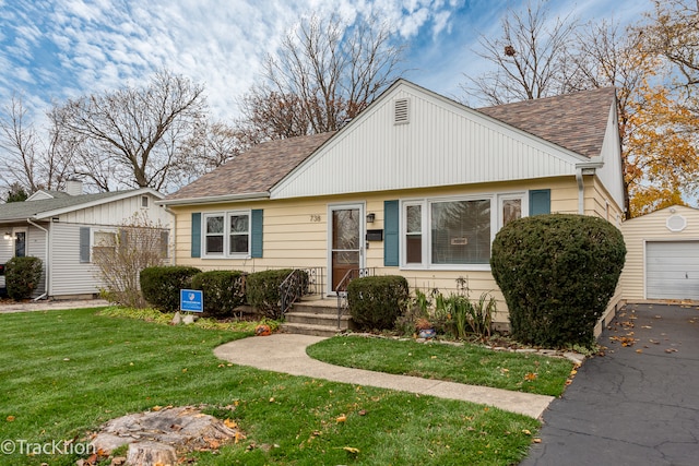 bungalow-style home with a front yard