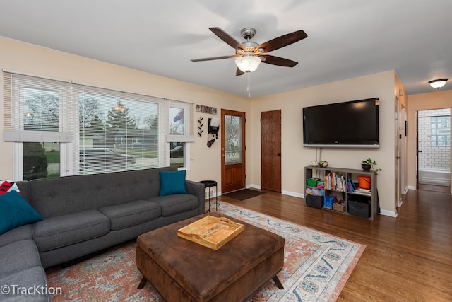 living room with hardwood / wood-style flooring, ceiling fan, and a healthy amount of sunlight