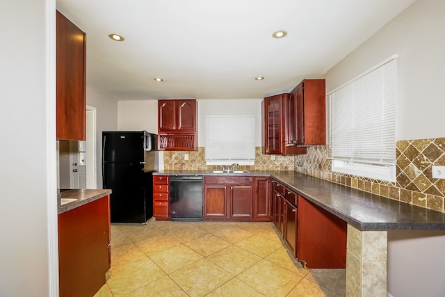 kitchen with black appliances, sink, decorative backsplash, light tile patterned floors, and kitchen peninsula