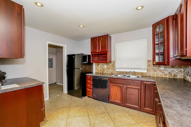 kitchen featuring light tile patterned floors, sink, tasteful backsplash, and black appliances