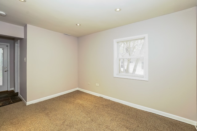 empty room featuring dark carpet