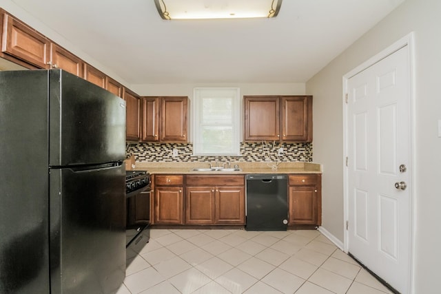3632 212th Pl, Matteson, IL 60443 - kitchen with black appliances, a sink, light countertops, decorative backsplash, and brown cabinets