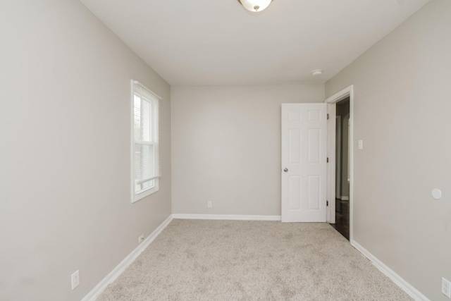 3632 212th Pl, Matteson, IL 60443 - spare room featuring light carpet, baseboards, and a smoke detector