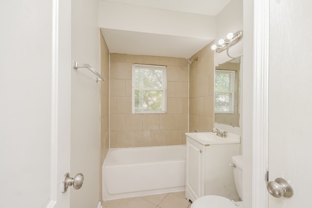 full bathroom with tile patterned floors, tiled shower / bath combo, toilet, and vanity