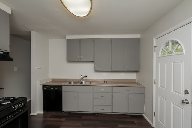 kitchen with dark hardwood / wood-style flooring, gray cabinetry, sink, black appliances, and range hood