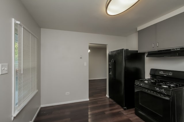 kitchen with black appliances and dark wood-type flooring