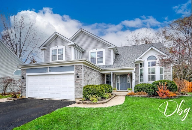 front facade with a garage and a front yard