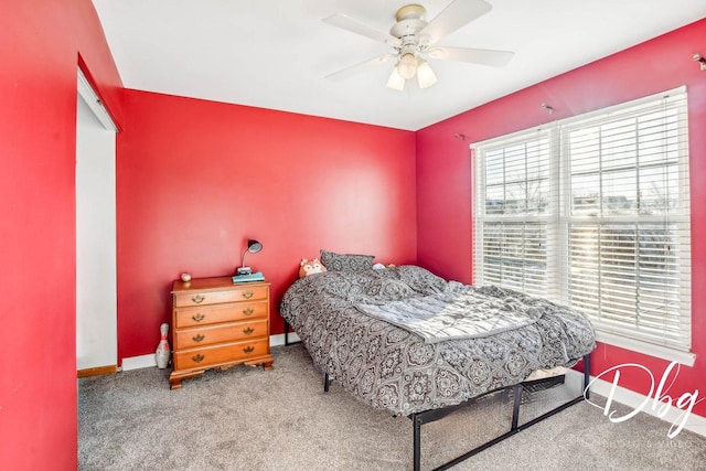 carpeted bedroom with ceiling fan