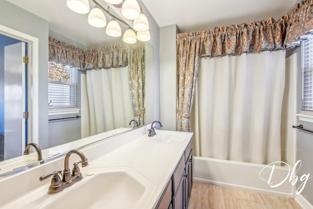 bathroom featuring vanity and shower / tub combo