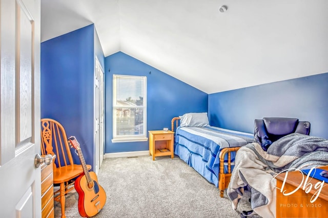 carpeted bedroom featuring vaulted ceiling