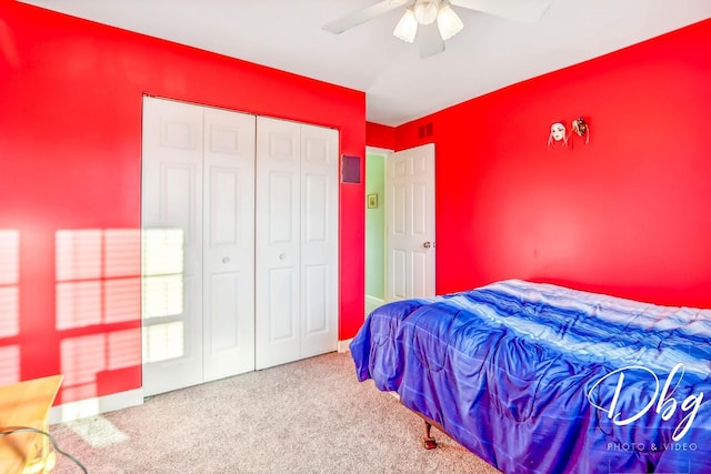 bedroom with carpet, a closet, and ceiling fan