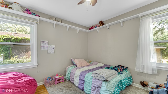 bedroom featuring wood-type flooring and ceiling fan