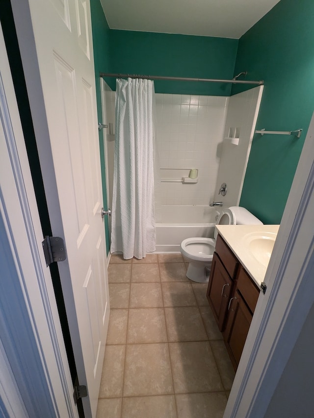 full bathroom featuring tile patterned floors, vanity, toilet, and shower / tub combo