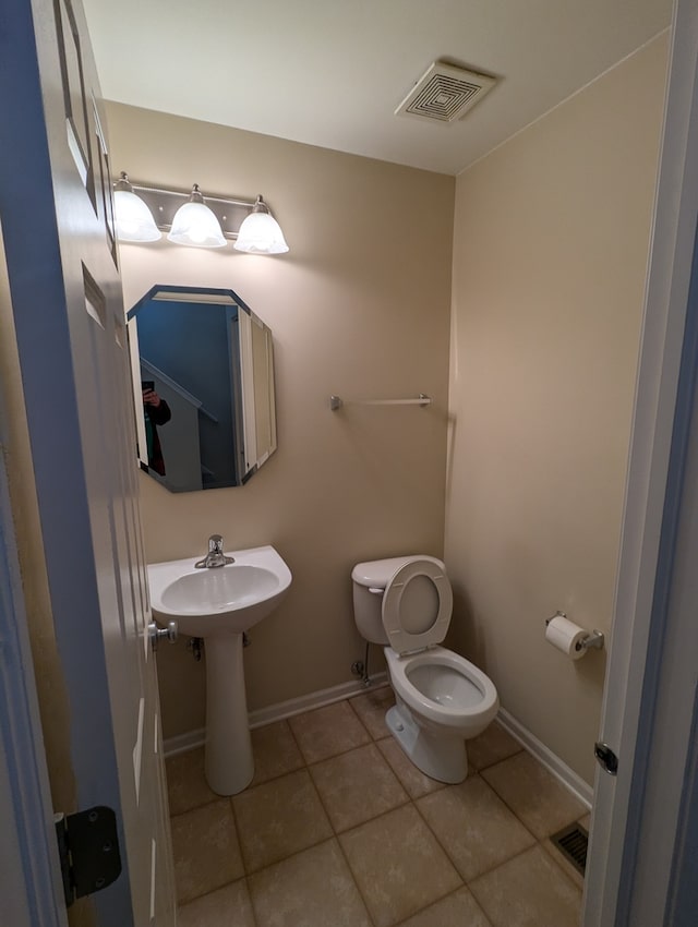 bathroom with tile patterned floors and toilet