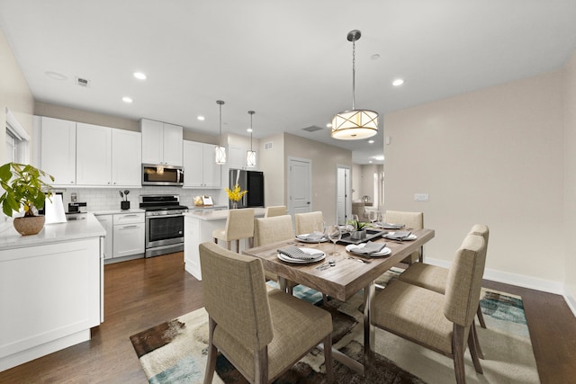 dining room featuring dark hardwood / wood-style flooring