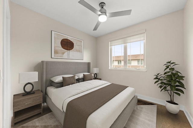 bedroom featuring ceiling fan and wood-type flooring