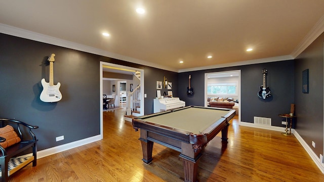 recreation room featuring ornamental molding, pool table, and light hardwood / wood-style flooring