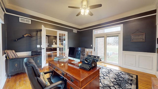 office featuring french doors, ceiling fan, ornamental molding, and light hardwood / wood-style floors