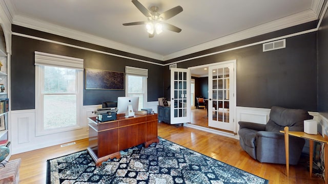 office space with crown molding, hardwood / wood-style flooring, french doors, and ceiling fan