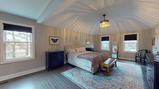 bedroom featuring vaulted ceiling and dark hardwood / wood-style flooring