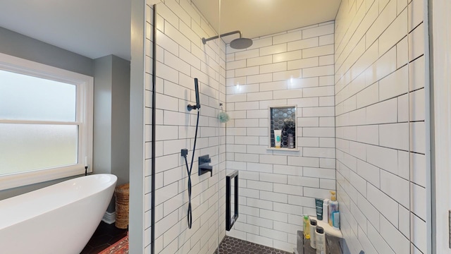 bathroom featuring separate shower and tub