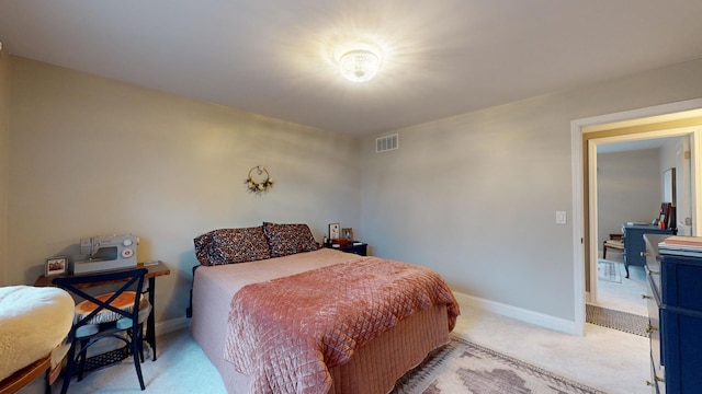 bedroom featuring light colored carpet