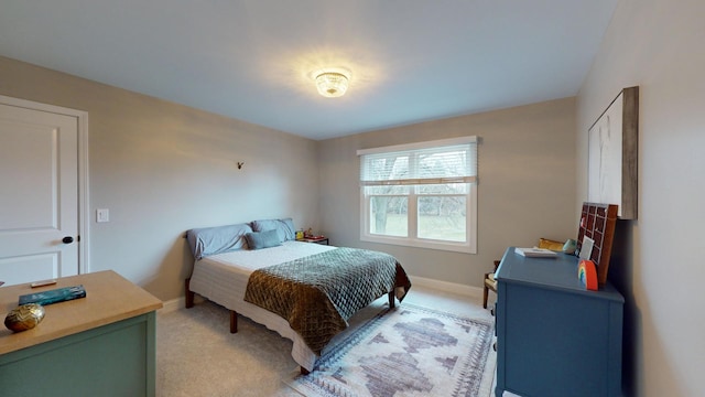 bedroom featuring light colored carpet